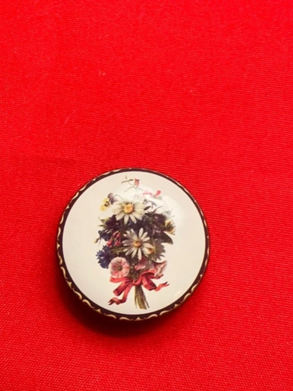 Round metal floral tin with lid